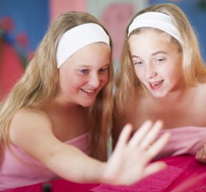 Two girls on a beauty farm pampering themselves